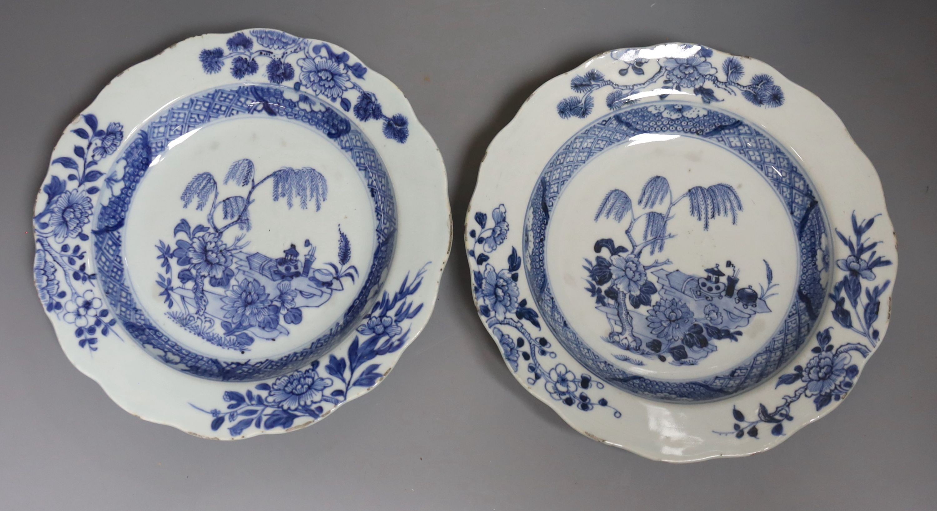 Three 18th century Chinese export porcelain bowls, largest 28 cm and two plates
